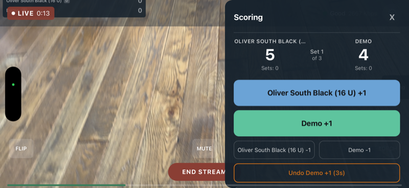 Scoring panel open during stream showing scores and +/- buttons